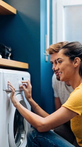 couple with laundry machine logo