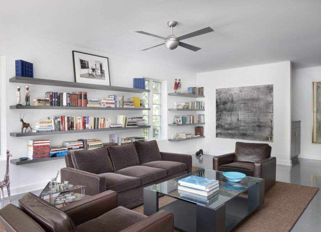 Modern Family room with modern bookshelves and Stainless steel fan.