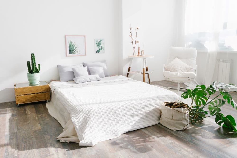 White bedroom with green accents