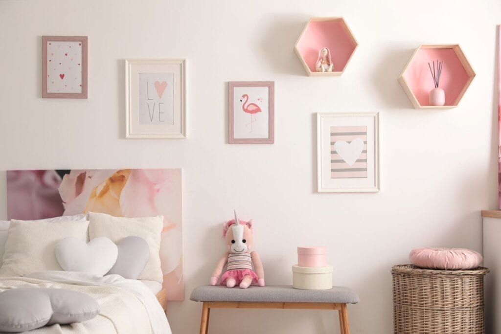 Girls bedroom with pink decor and heart-shaped pillows