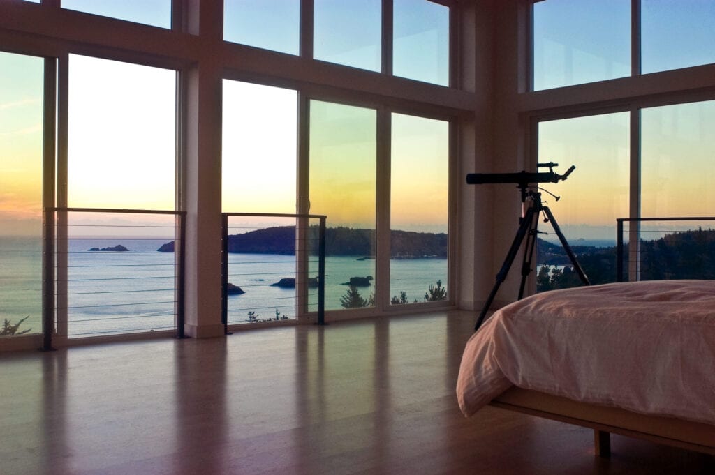 Telescope in bedroom with panoramic ocean view