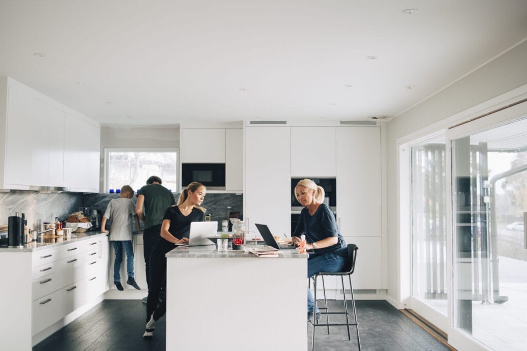 kitchen island with family surrounding 