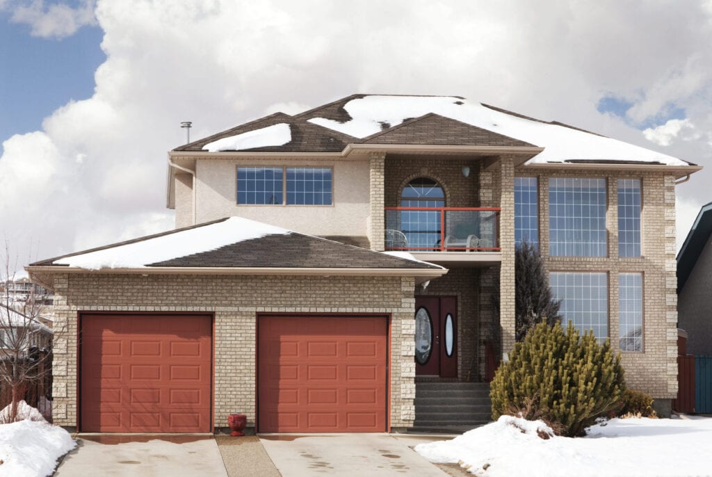 Two story single family home with attached garage.