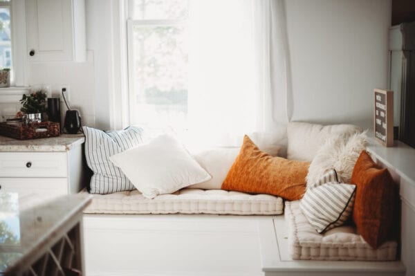 A fun and cozy window seat bathing in the morning sun