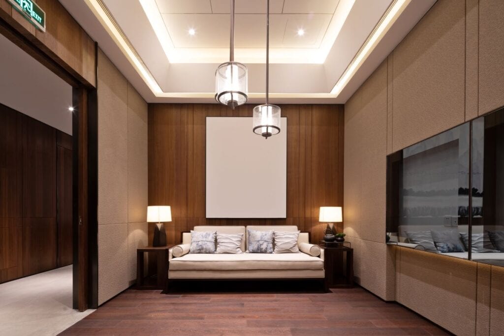 Modern living room with wood walls and modern pendant lighting