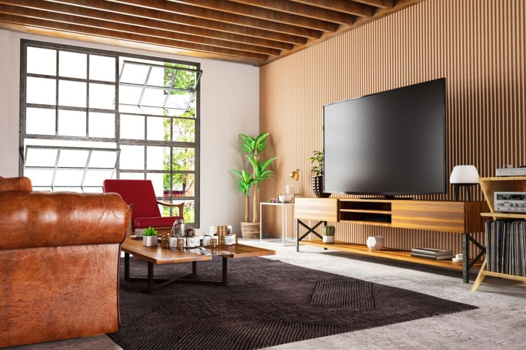 Modern industrial style living room with wood panel wall and wood entertainment console