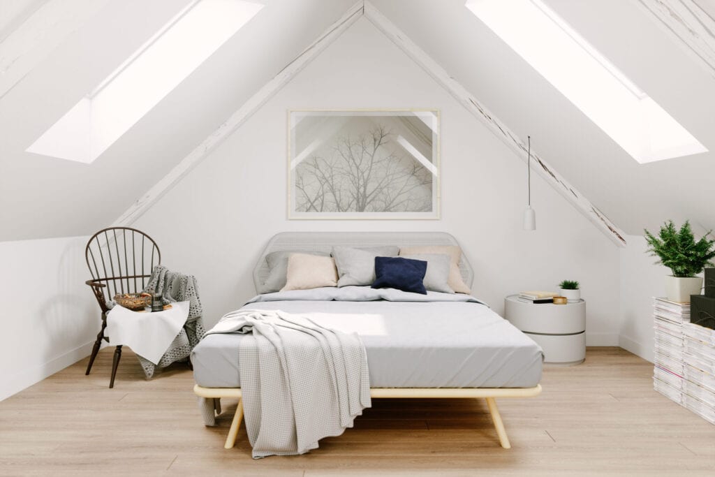 Interior of a Scandinavian style attic bedroom.