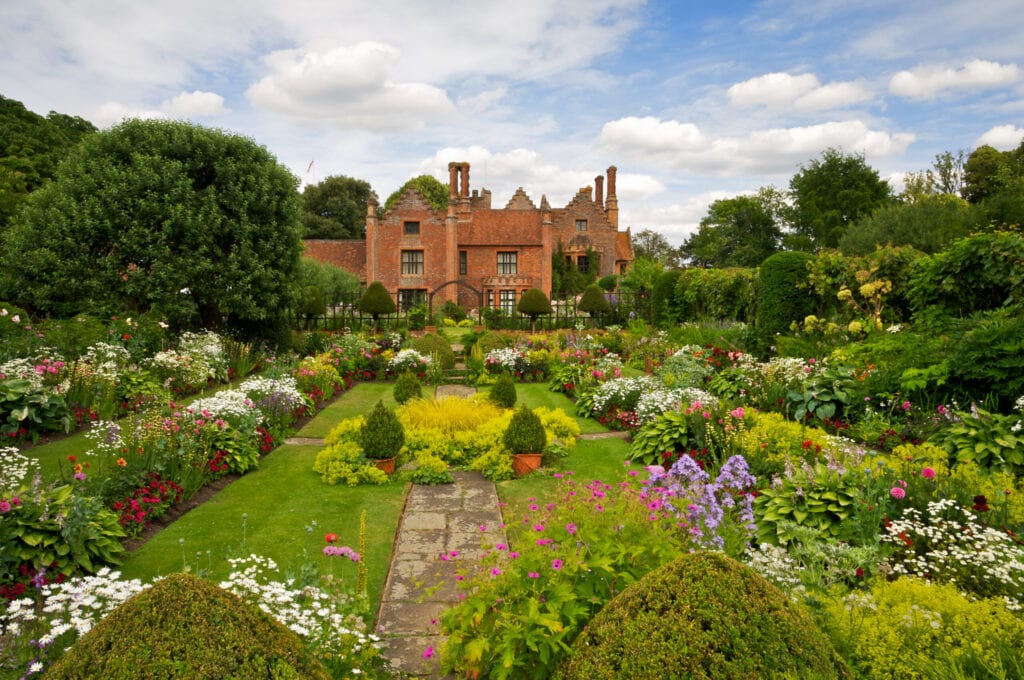 The beautiful award winning gardens of Chenies Manor in Buckinghamshire with a wide variety of flowering plants and shrubs.