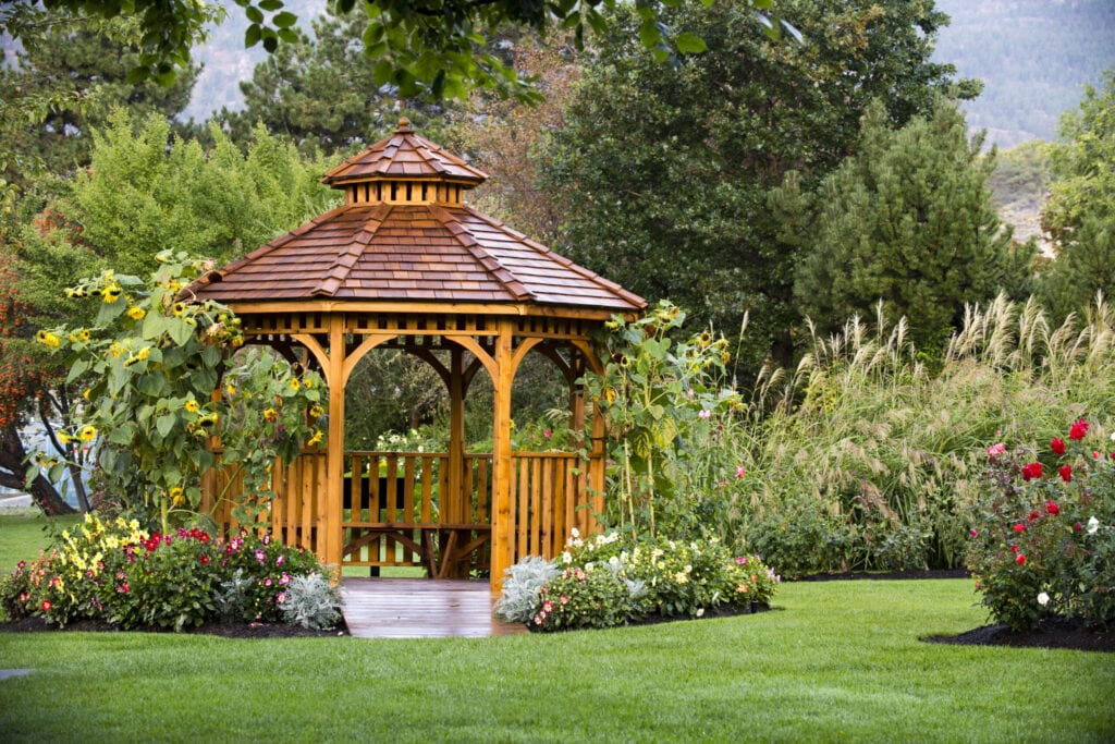 Cedar gazebo in a park at the Penticton Rose Garden located on the Trans Canada Trail in Penticton, British Columbia, Canada.