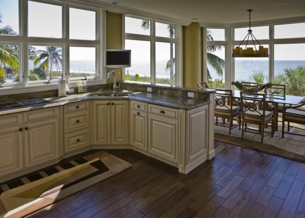 Interior of a beach house in Florida on the Gulf of Mexico.  The kitchen and dining room have a beautiful view of the beach.