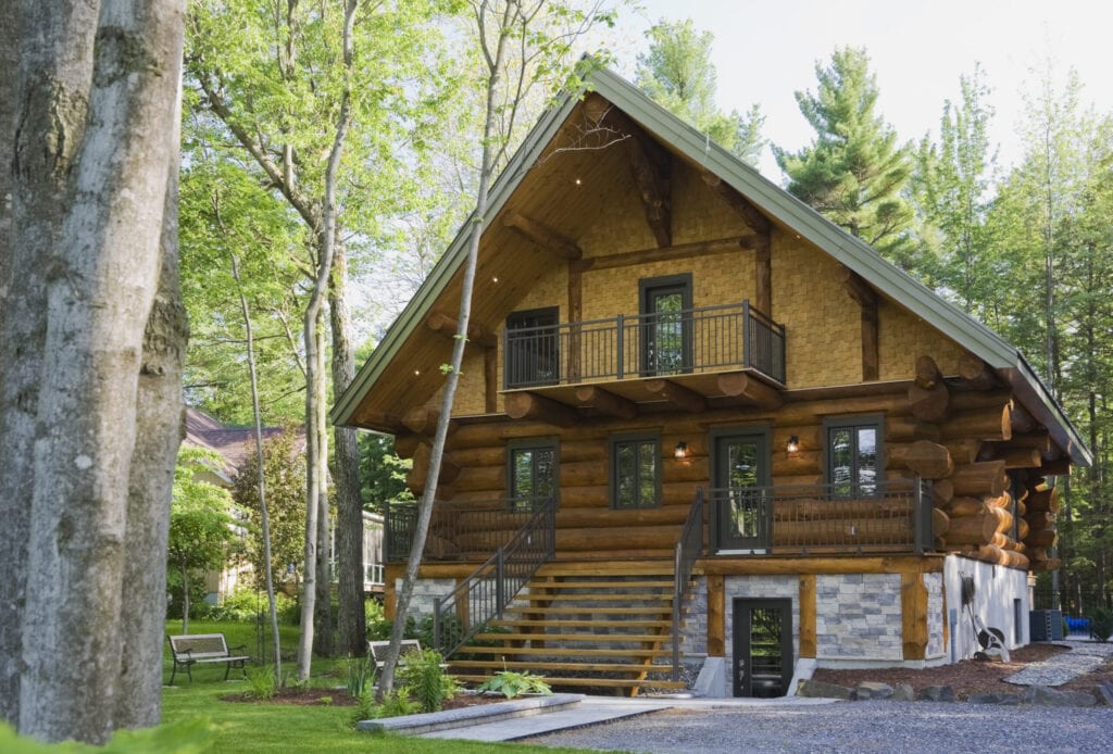 Luxurious Scandinavian cottage style log home facade in late spring, Quebec, Canada. This image is property released. CUPR0276