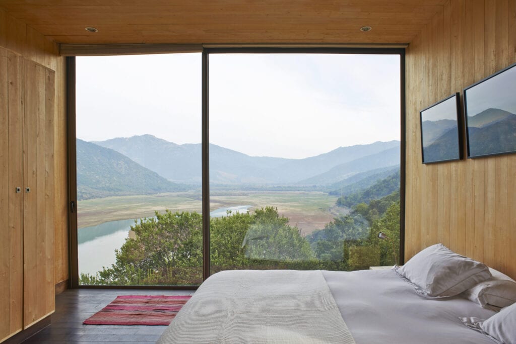 Hotel room with panoramic view of the vineyards in San Vicente, Chile; Vina Vik Retreat