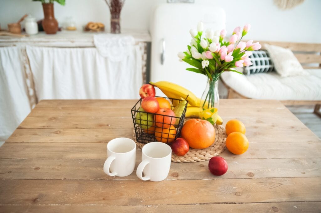 citrus fruits in a wire basket on a table 