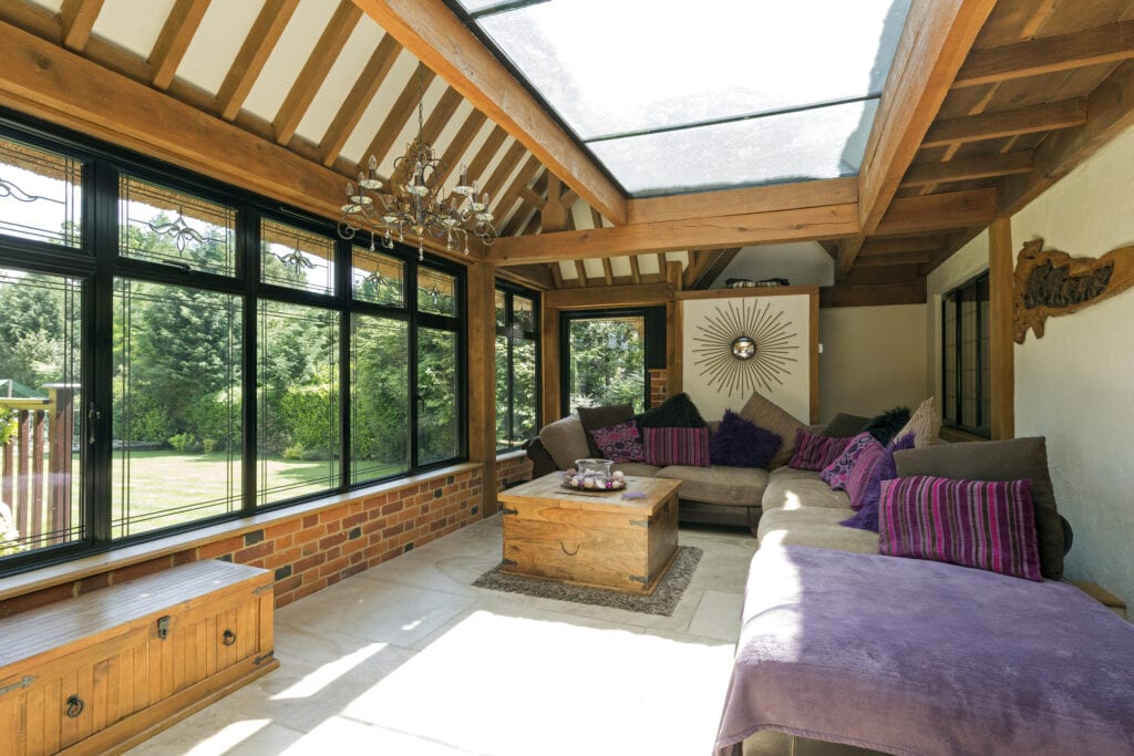 Cushioned benches in sunny conservatory