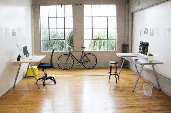 Bicycle and desks in modern office