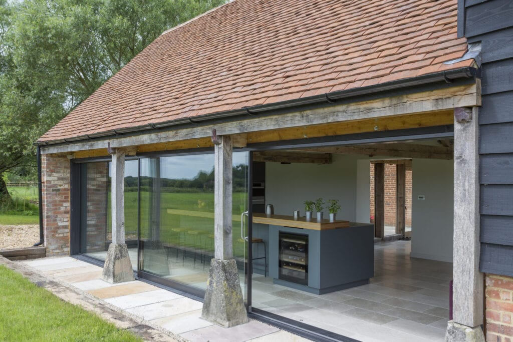 Glass sliding doors of converted barn home