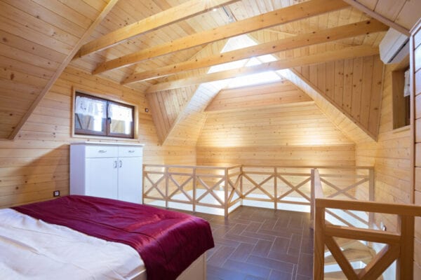 Bedroom in modern style log house