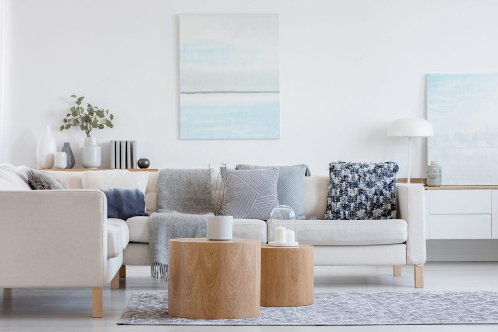 white couch with blue pillow living room decor 