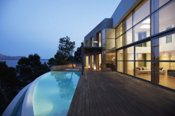 Pool outside modern house at twilight