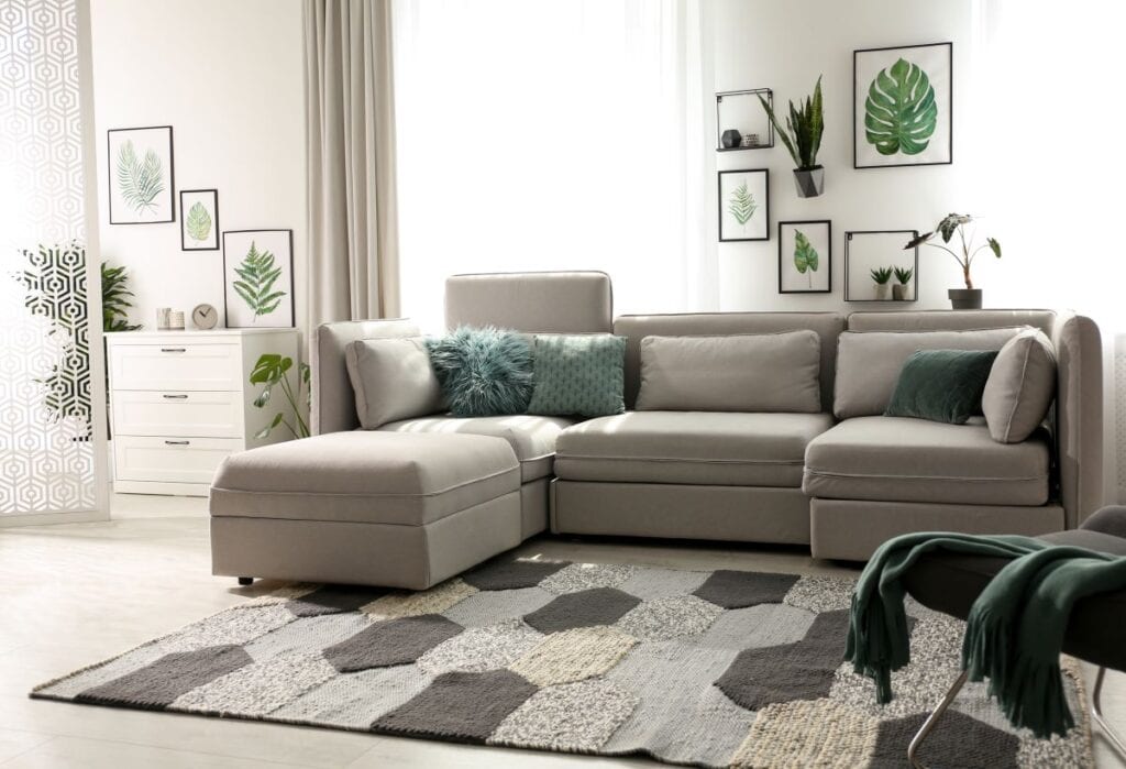 Living room with green accents and many different textures that create balance