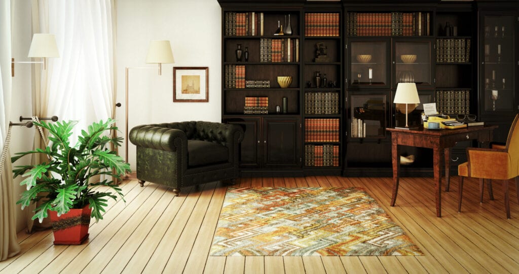 Digitally generated classical home interior (home library) with stylish furniture such as massive bookshelf, home office desk with typewriter and a very comfortable (perfect for reading a good book) Chesterfield armchair.  This digitally generated image was rendered with photorealistic shaders and lighting in Autodesk® 3ds Max 2016 with V-Ray 3.6 and post-processed with a creative film style for more impact and atmospheric mood.