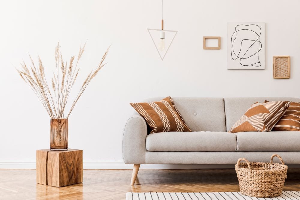 Boho interior design, abstract wall art, gray couch