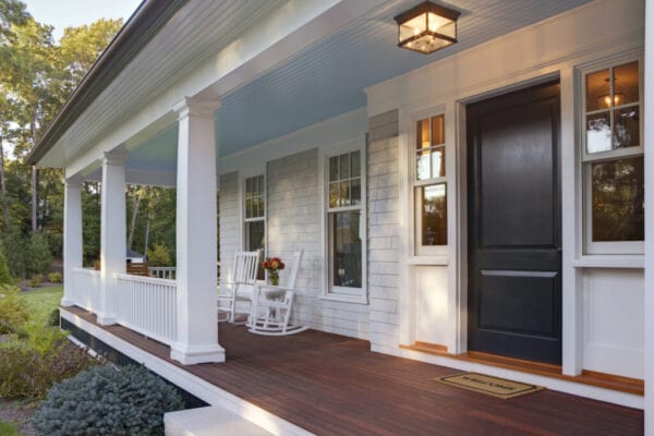 Front porch of new custom home with sun light.