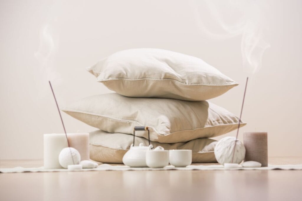 Home meditation items, incense, pillows, and teapot