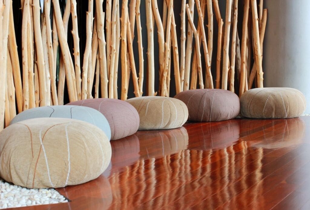 Meditation room with floor cushions and bamboo