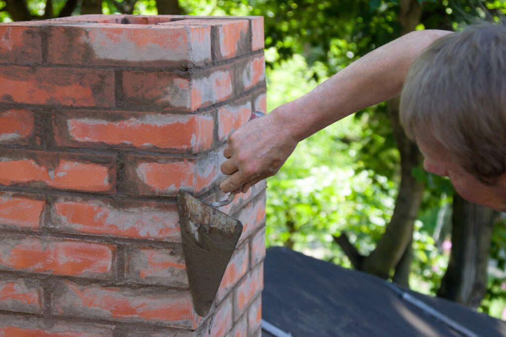 Man building chimney