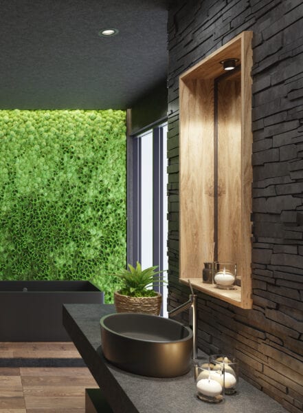 Luxurious modern home spa bathroom with matte black tiles and green moss plant wall