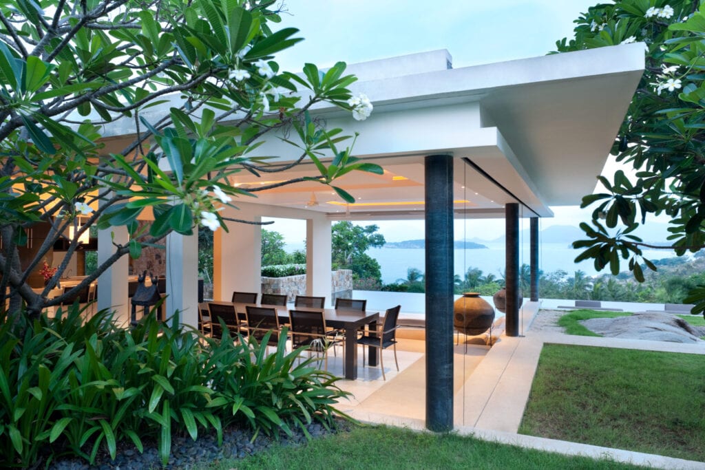 Modern Villa In The Tropics In The Early Morning At Sunrise.