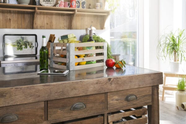 Crate of groceries in country style kitchen