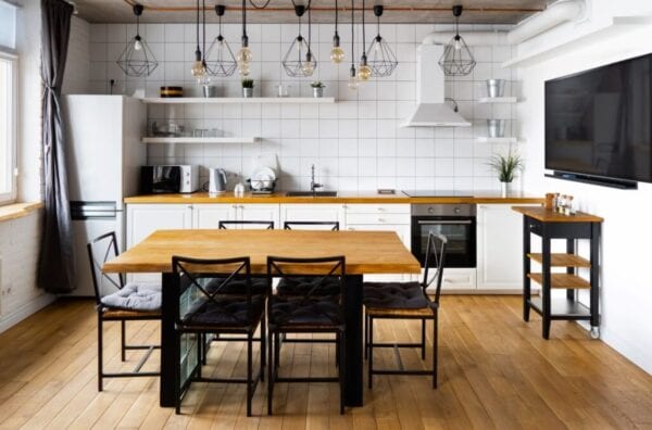 Rolling kitchen island stored at the side of the room