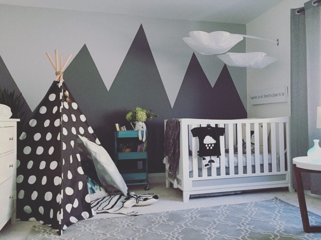 grey baby room with mural