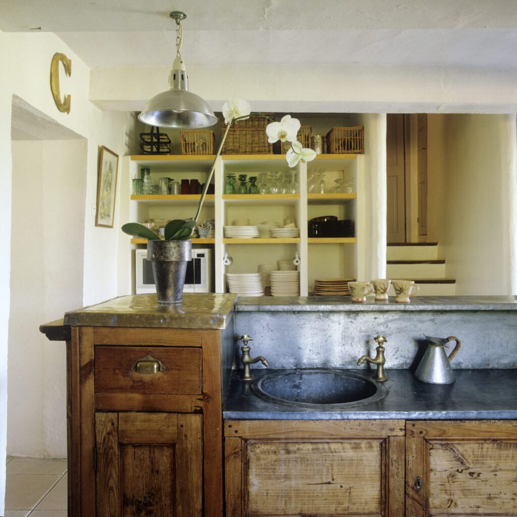 Luberon farmhouse renovation with zinc bar rescued from a fire in the Lacoste's Café