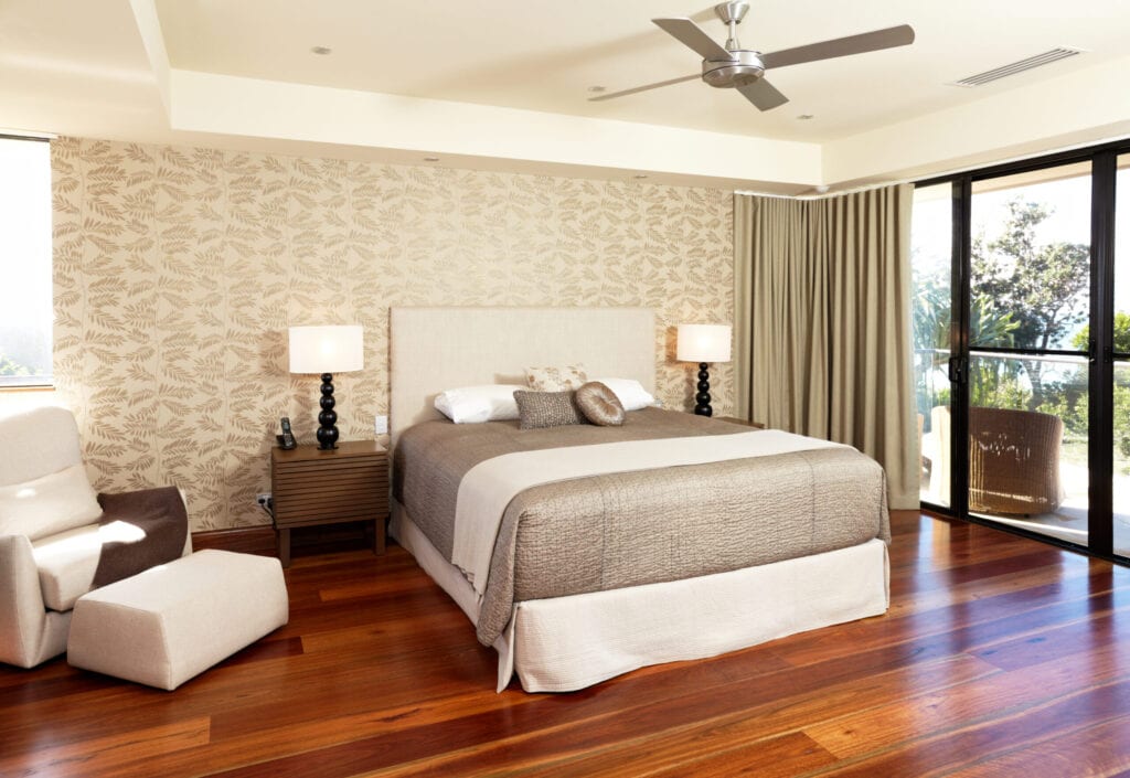 of a large Luxurious Australian master bedroom with furnishings.