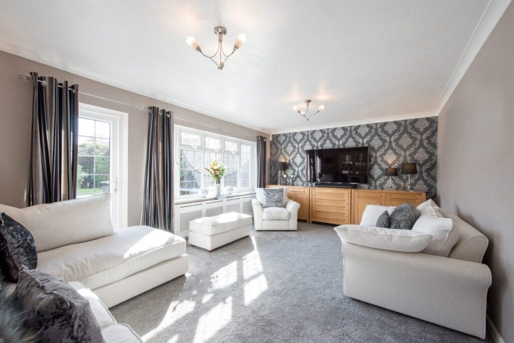 A general interior view of a living room lounge within a home.