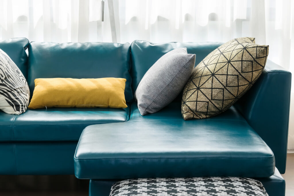 modern living room with green sofa and pillows at home