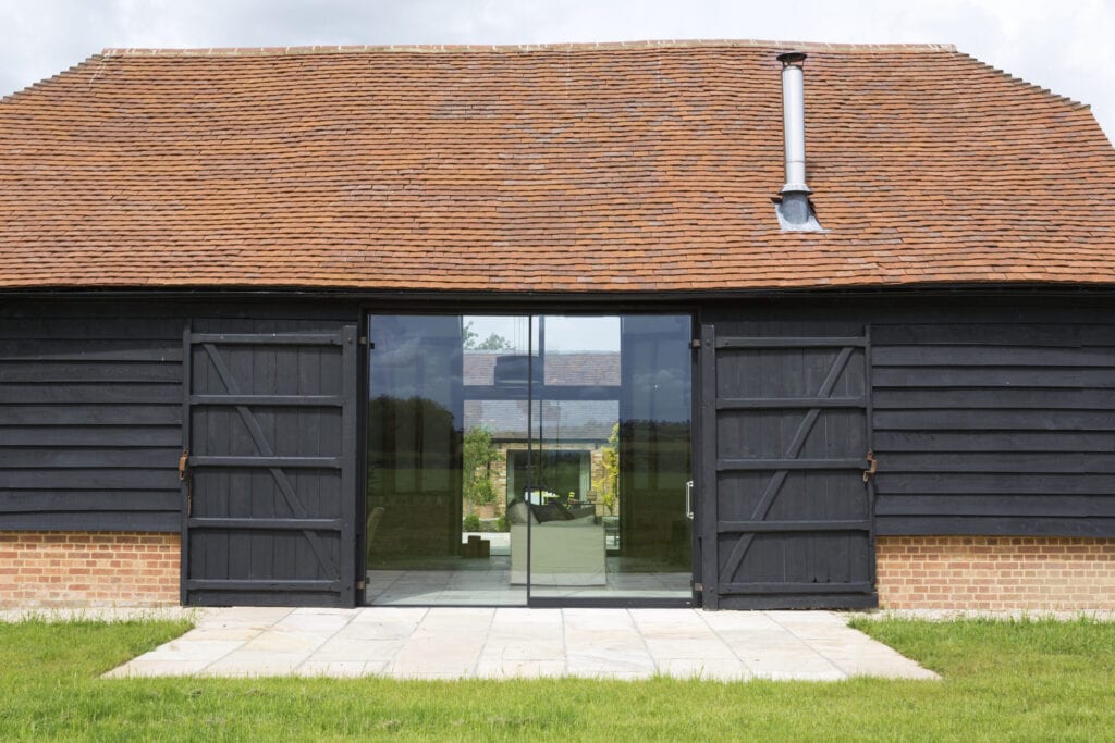 Glass sliding doors of converted barn home