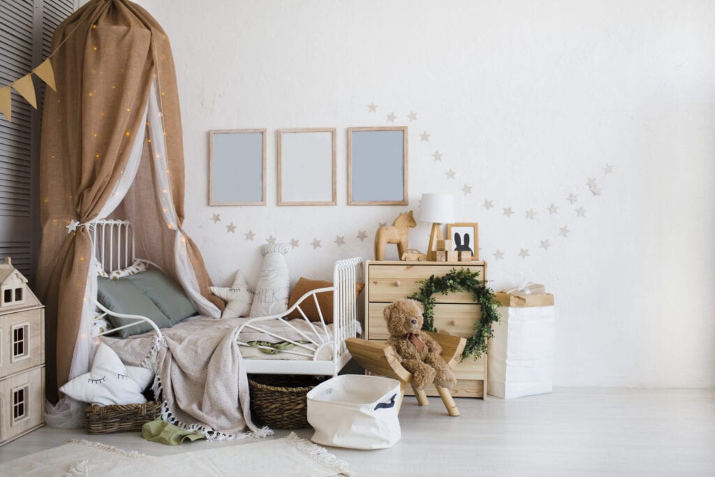 Stylish scandinavian baby room with crib, dresser, wooden toys and lamp. zero waste. eco-friendly materials