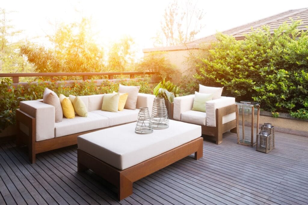 Modern patio set, brown wood or wicker furniture with white upholstery