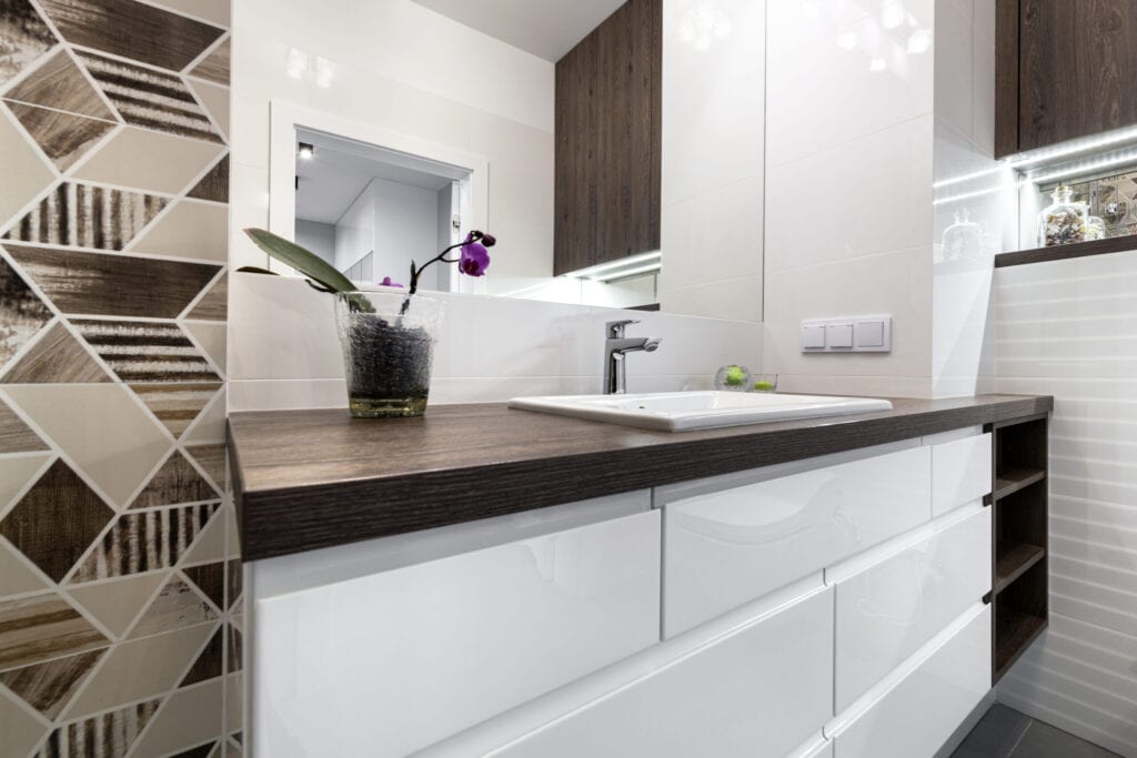 Modern interior design - bathroom with abstract tiles on the wall