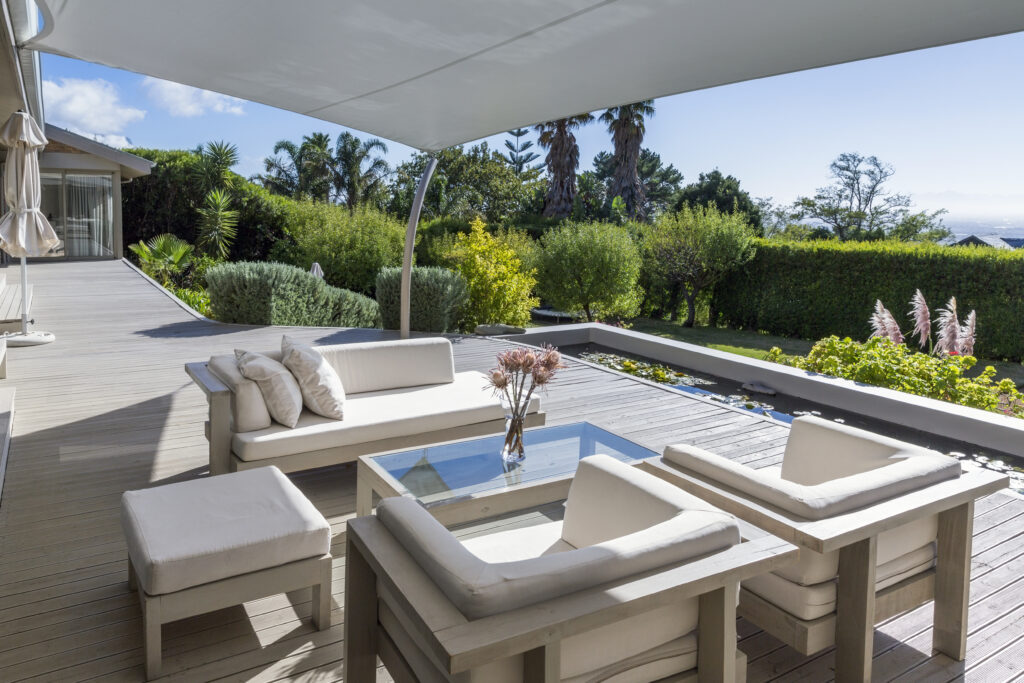 Seating area at patio with lawn in background