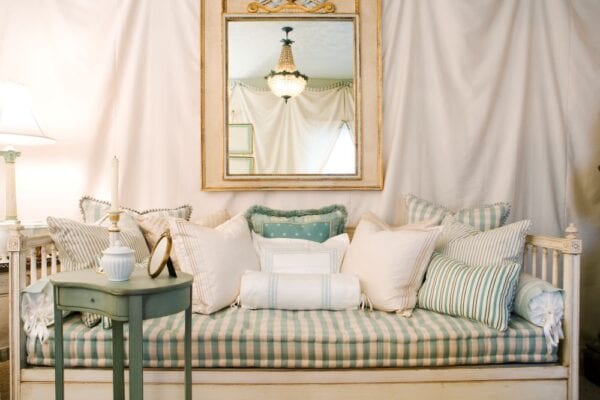 Vintage daybed with large mirror and teal side table