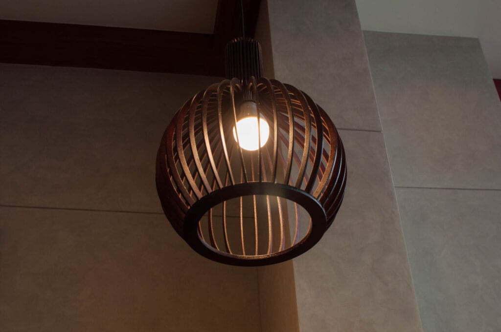 A modern chandelier hanging on a ceiling