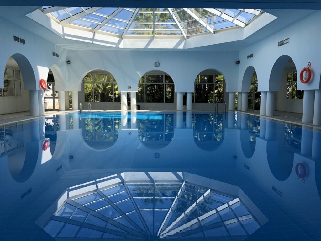 Indoor swimming pool with glass ceiling