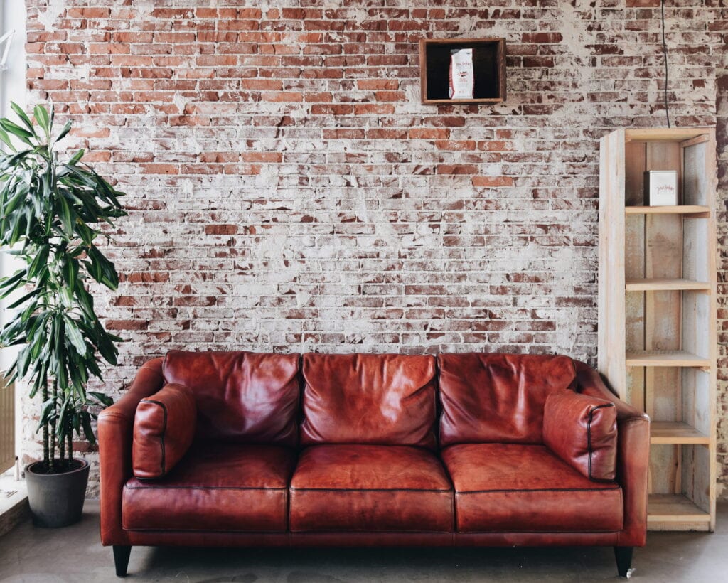 brick wall leather couch