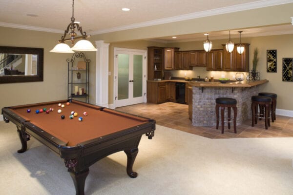 Lower level game room and bar in residential home.