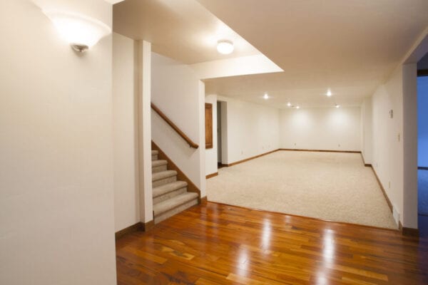 Spacious Finished Basement with Carpet and Hardwood Floors